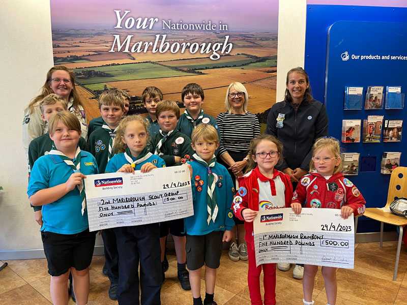 Scouts holding cheque from Nationwide